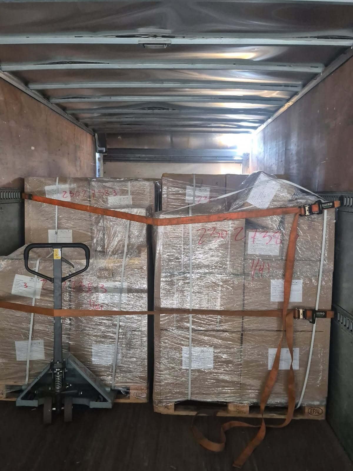Stacked pallets loaded and secured for transport