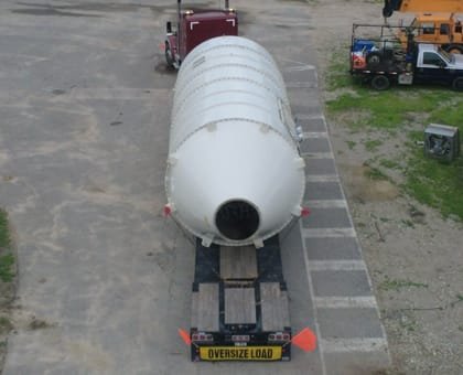 Oversized tank running on a step deck