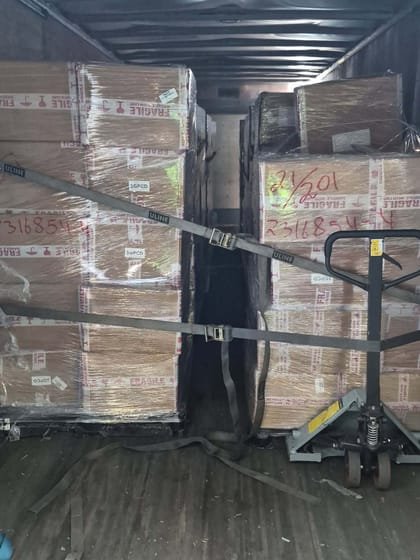 Cartons strapped down inside a dry van