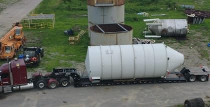 Industrial tank loaded on a lowboy