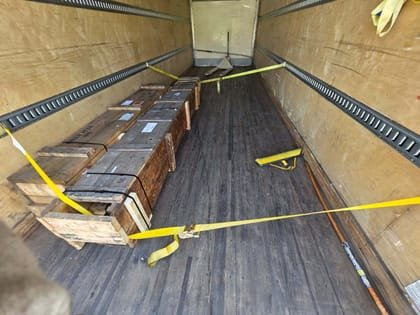 Long freight strapped the length of the deck