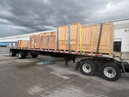 Crated freight riding a flatbed