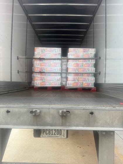 Palletised cases stacked in a reefer