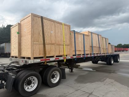 Crated machinery centred on a flatbed