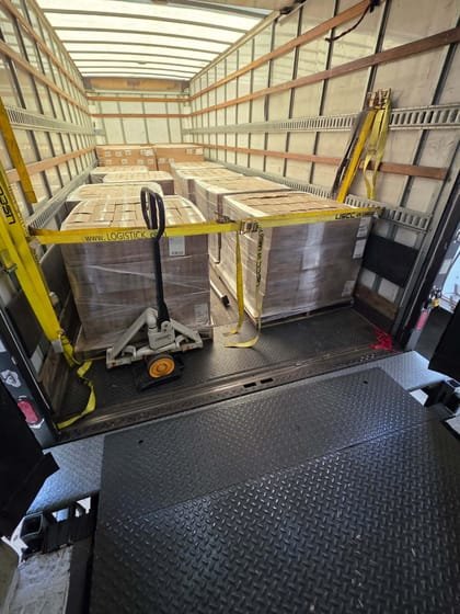 Pallet jack and strapped freight mid-load