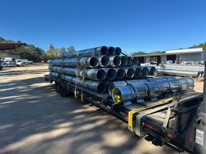 Bundled pipe loaded across a flatbed