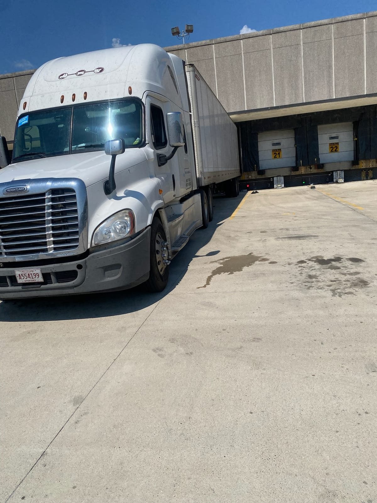 Sleeper tractor backed into a loading dock